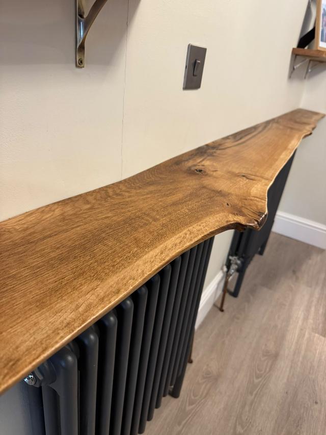 Live-edge oak shelf over a radiator