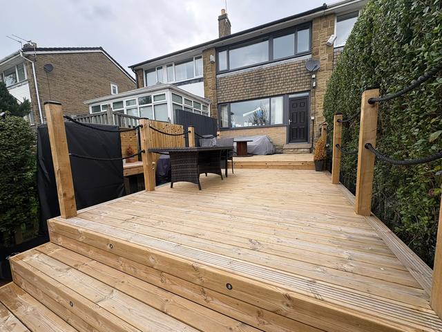 Raised decking with steps and rope balustrade