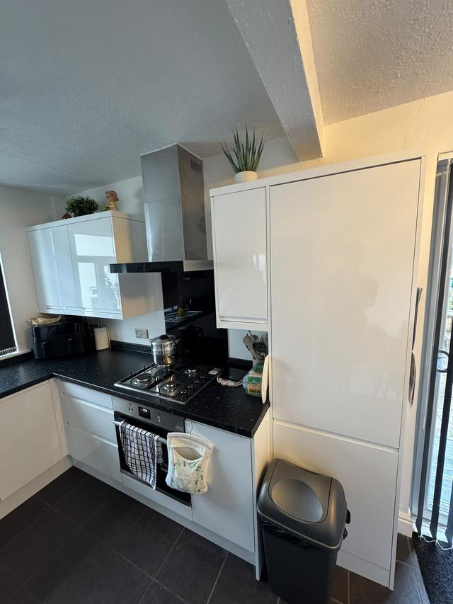 Gloss kitchen and tall larder unit