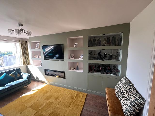 Media wall with display cabinets and fire