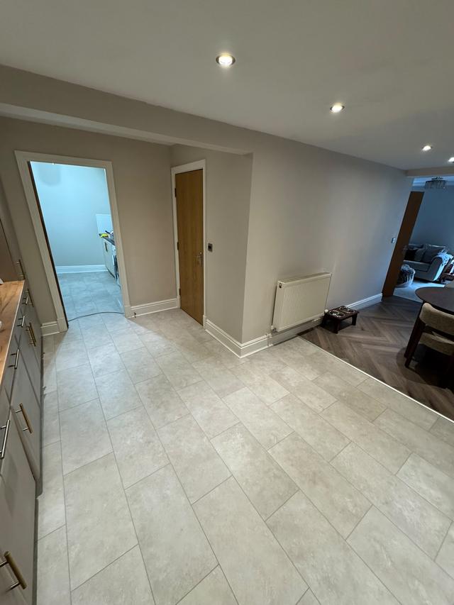 Stone-effect floor through kitchen and hallway